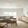 A modern living room with a sofa, coffee table, and a sideboard. Produktbild-Vorschau