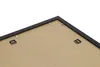 The back of a black picture frame with mounting hardware visible. Produktbild-Vorschau