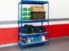 A blue metal shelving unit filled with various items including containers, boxes, and tool cases, set against a red and gray wall. Produktbild-Vorschau