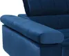 A close-up view of the armrest and side of a dark blue velvet sofa. Náhled obrázku produktu