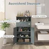 A bathroom storage cabinet is shown in a well-lit bathroom setting, with various toiletries and decorative items displayed on and inside it. The image highlights the storage capacity and features of the cabinet. Náhled obrázku produktu