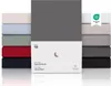 A stack of fitted sheets in various colors, with packaging for one sheet in the foreground. Anteprima dell’immagine prodotto