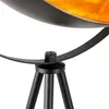 A close-up view of the base of a black floor lamp with a gold interior. Produktbild-Vorschau