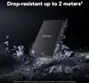 A black Lexar external SSD is shown falling amidst debris, highlighting its drop-resistant feature. Produktbild-Vorschau