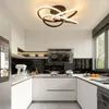 A modern kitchen with white cabinets, black marble backsplash, and a sleek ceiling light fixture. Produktbild-Vorschau