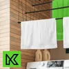 A laundry room scene with towels hanging on a drying rack above a washing machine. Produktbild-Vorschau