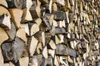 A close-up view of a stack of firewood. Podgląd zdjęcia produktu