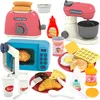 A collection of toy kitchen appliances and food items, including a toaster, microwave, stand mixer, and various food replicas, arranged on a white background. Produktbild-Vorschau