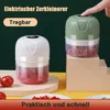 Two electric choppers are displayed, one white and one green, with chopped ingredients inside. A finger is shown pressing the button on the green chopper. Produktbild-Vorschau