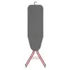 A freestanding ironing board with a gray fabric surface and rosé-colored metal legs, shown against a white background. Náhled obrázku produktu