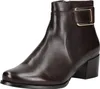 A single brown leather ankle boot with a gold buckle detail is shown against a white background. Voir les images du produit