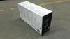 A box of HP toner is placed on a concrete floor with a yellow line in the background. Voir les images du produit