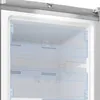 Close-up view of the interior of a refrigerator or freezer, showing transparent drawers and shelves. Voir les images du produit