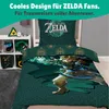 A bed set with a Zelda theme is displayed in a bedroom setting, with shelves holding related items. Produktbild-Vorschau
