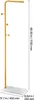 A gold coat rack with a white base and measurement indicators. Anteprima dell’immagine prodotto