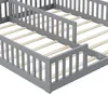 A close-up view of a gray wooden bunk bed frame with slats for mattresses. Produktbild-Vorschau