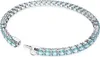 A close-up, studio shot of a silver tennis bracelet with blue stones against a white background. Voir les images du produit
