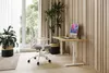 A modern home office setup with an ergonomic chair and a standing desk. Produktbild-Vorschau