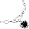 A close-up shot of a silver bracelet with a black heart-shaped charm. Anteprima dell’immagine prodotto