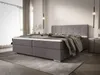 A bedroom scene featuring a large bed. Náhled obrázku produktu