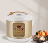 A multi-function fermentation pot with a digital display and various function buttons, placed on a surface with some vegetables and garlic in the background. Podgląd zdjęcia produktu