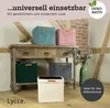 Storage bins are displayed on a rustic wooden console table with brick and wooden beams in the background. Voir les images du produit