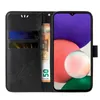 A black flip phone case with floral and butterfly embossing, showing credit cards and a banknote inside, and a smartphone displayed in the case. Produktbild-Vorschau