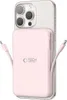 A pink power bank is attached to the back of a silver smartphone. Podgląd zdjęcia produktu