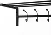 A black metal coat rack with a shelf and multiple hooks, mounted on a white wall. Produktbild-Vorschau