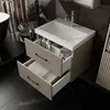 A modern bathroom vanity with a sink and drawers, featuring a geometric patterned wall. Produktbild-Vorschau