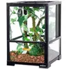 A reptile terrarium with artificial plants and substrate. Anteprima dell’immagine prodotto