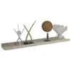 A long, light-colored shelf with various decorative objects on it. Podgląd zdjęcia produktu