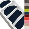Several dark blue stair mats are shown on white stairs. Anteprima dell’immagine prodotto