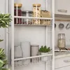 A white shelving unit with various kitchen items on its shelves. Podgląd zdjęcia produktu