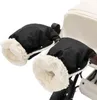 A pair of black stroller hand warmers with cream-colored fleece lining, attached to a stroller handle. Anteprima dell’immagine prodotto
