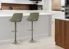 Two bar stools are shown in a modern kitchen setting, in front of a counter. Podgląd zdjęcia produktu
