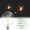 A large, clear LED bulb is shown in the foreground, with two decorative pendant lights in the background. Technical specifications for the bulb are listed on the right side of the image. Produktbild-Vorschau