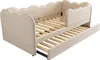 A beige upholstered daybed with a pull-out trundle bed, shown with the trundle extended. Podgląd zdjęcia produktu