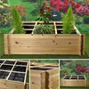 A wooden raised garden bed with plants and a grid structure, shown in multiple close-up and full views, set against a blurred background of flowers and greenery. Produktbild-Vorschau