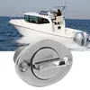 A boat is sailing on the water, and a close-up of a boat drain plug is in the foreground. Podgląd zdjęcia produktu