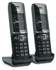 Two black Gigaset cordless phones are shown in their charging bases against a white background. Anteprima dell’immagine prodotto