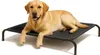 A yellow Labrador dog is lying on a black elevated dog bed against a white background. Náhled obrázku produktu