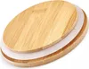 A close-up, angled view of a round bamboo lid with a white silicone seal, set against a white background. Produktbild-Vorschau