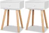 Two white nightstands with wooden legs on a white background. Náhľad obrázku produktu