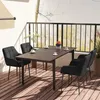 A dining set on a balcony with a railing and plants in the background. Podgląd zdjęcia produktu