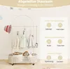 A children's clothing rack with various items of clothing and accessories displayed, along with descriptive text and icons. Náhled obrázku produktu