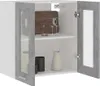 A close-up, front-facing view of a white wall cabinet with gray concrete-effect doors and glass panels. The cabinet is open, revealing two shelves with kitchen items like glasses, a cutting board, and pitchers. Náhľad obrázku produktu