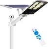 A solar street light with a solar panel and a remote control, shown against a white background. Anteprima dell’immagine prodotto