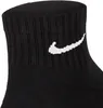 A close-up shot of a black Nike sock with the white Nike swoosh logo. Anteprima dell’immagine prodotto