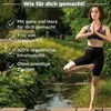 A woman is doing yoga in a garden setting next to a stream. Produktbild-Vorschau